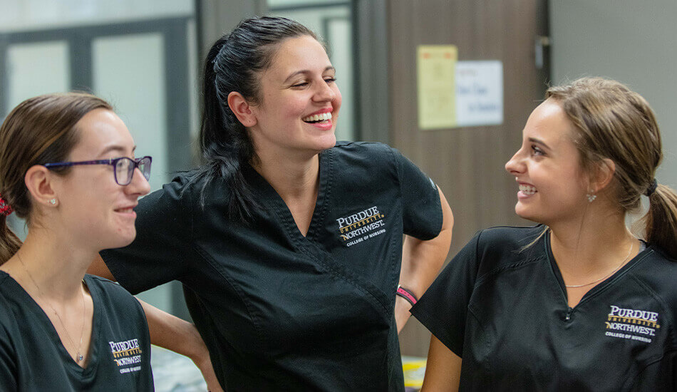 group of smiling nursing students in PNW scrubs